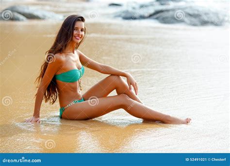 Tanned Brunette Sitting On The Beach Stock Image Image Of Body Slim