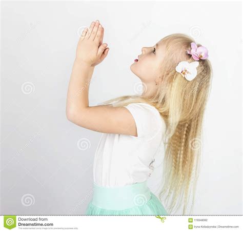 Little Blond Girl Folded Her Hands In Prayer To God A Little An Stock