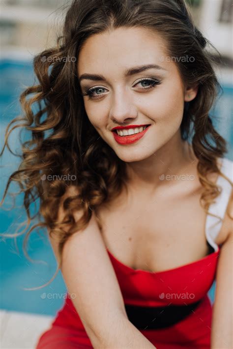 Happy Beautiful Woman In Red Dress On The Beach Stock Photo By Fentonroma