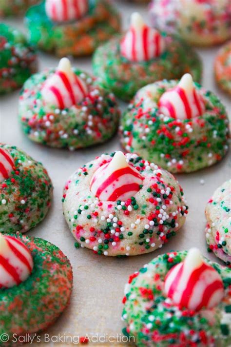 Chocolate packed hershey kiss cookies are rolled in sugar & baked with a hershey's kiss in the middle. Candy Cane Kiss Cookies - Sallys Baking Addiction