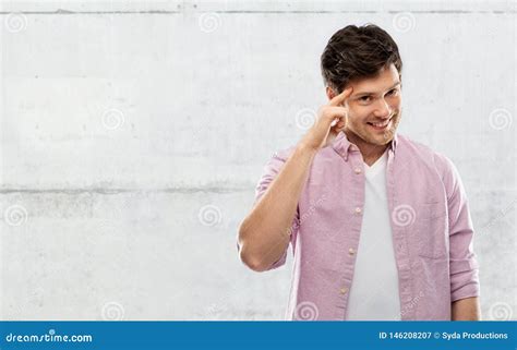Smiling Young Man Pointing Finger To His Head Stock Image Image Of