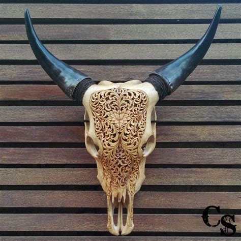 Hand Carved Bull Cow Skull With Lotus Heart Design In A Brown Color