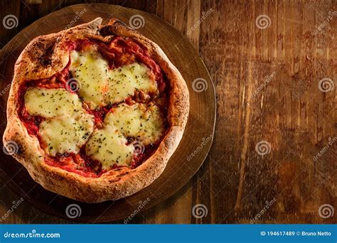 Brazilian Pizza With Mozzarella Cheese Tomato Sauce And Oregano On A