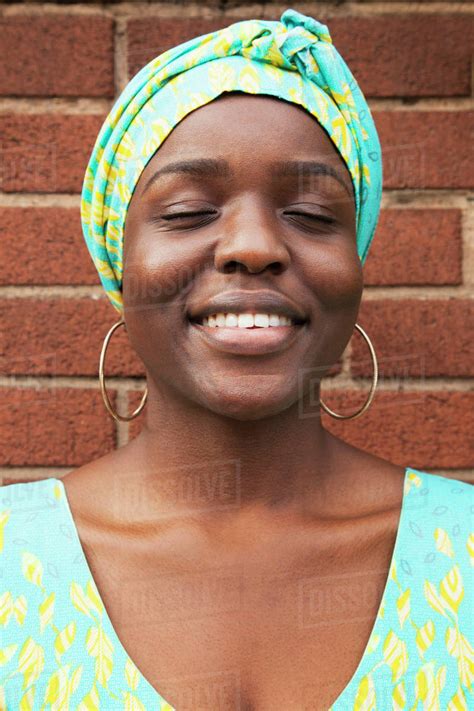 Portrait Of Smiling Black Woman With Eyes Closed Stock Photo Dissolve