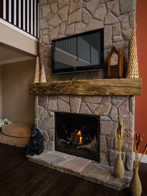 In the process of removing the wall, chip gaines found the original fireplace underneath, and decided to keep it as a unique design element. Best Barn Beam Mantel Design Ideas & Remodel Pictures | Houzz