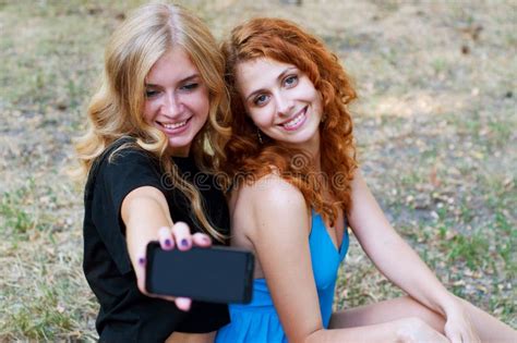 two girlfriends taking a selfie stock image image of friends park 57594083