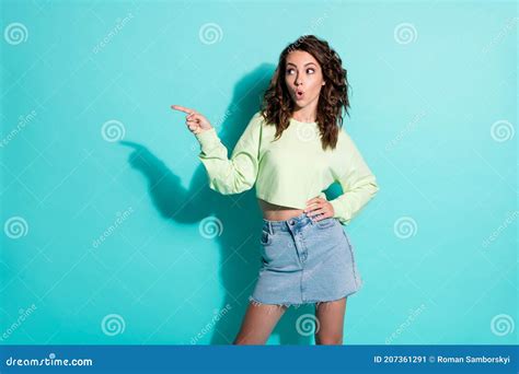 Photo Portrait Of Curly Pretty Brunette Pointing With Finger Looking At Blank Space Isolated On