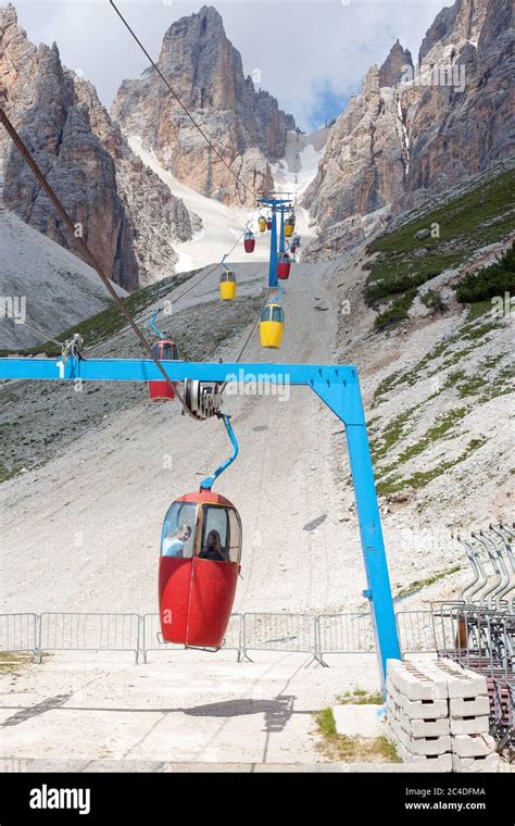 Colorful Cable Car Leading To Forcella Staunies With Two Young Girl