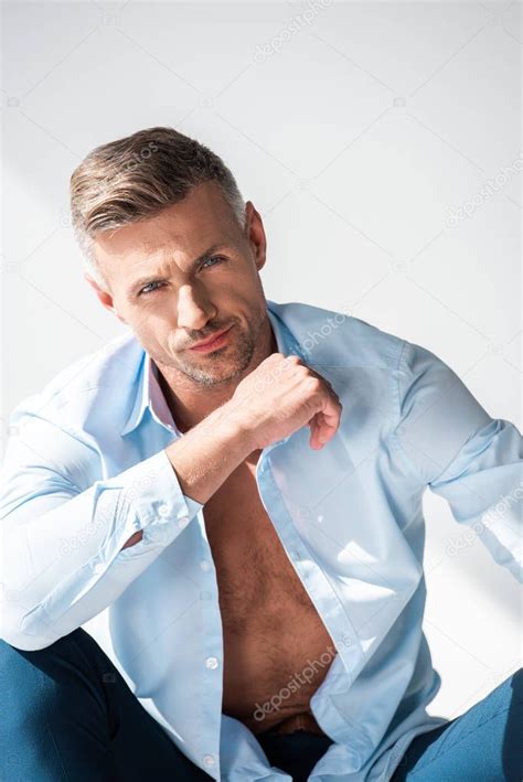 Handsome Sexy Man Unbuttoned Shirt Looking Camera Isolated White Stock Photo IgorVetushko