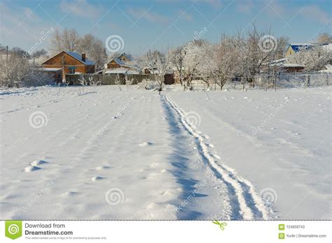 Winter Landscape With Pedestrian Path Through Snow Covered Field In