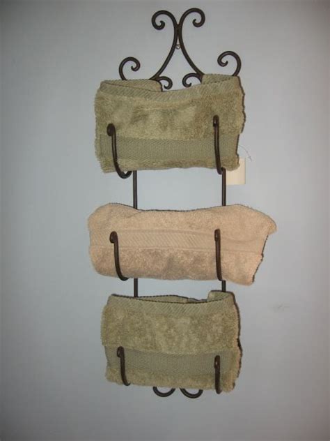 Sometimes, you get the over the door style towel racks like this model. Tuscan Wrought Iron Wall Wine Rack Shelf Towel Holder ...