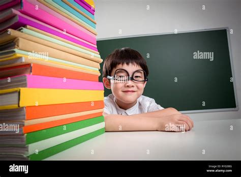 Primary school students and textbooks Stock Photo - Alamy