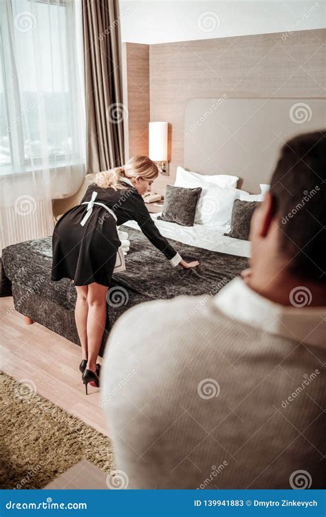 Man Watching Slim Hotel Maid Working In His Room Stock Image Image Of