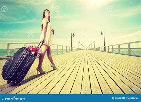 Young Woman Walking With Suitcase On Wheels Stock Photo Image Of