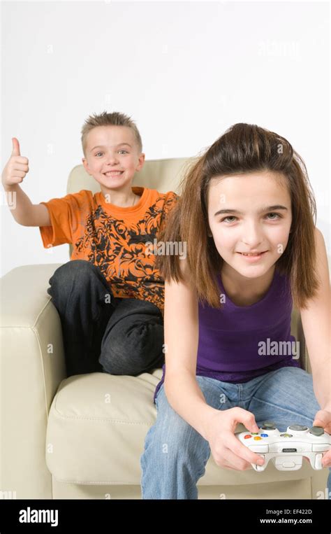 Siblings Playing Video Game Stock Photo Alamy