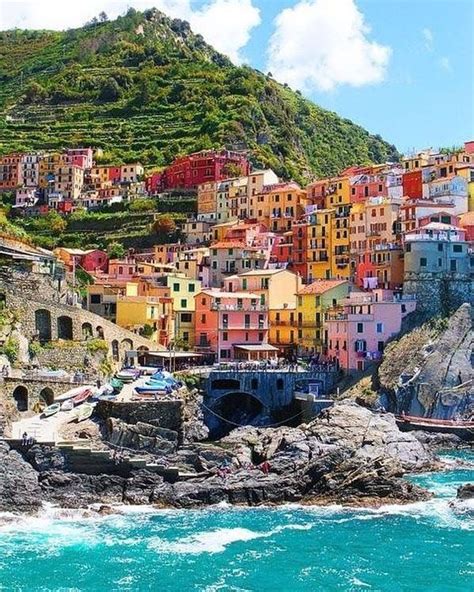 Colorful Houses On The Hillside Overlooking The Ocean