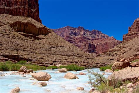 Cliffs Above The Blue Water Of The Little Colorado River Stock Photo