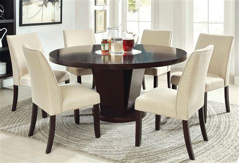 Dining table features a top that is designed specifically to prevent damage caused from pooling by allowing water to pass through freely and a lazy susan. 60 Inch Rees Espresso Round Dining Table with Lazy Susan