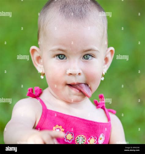 Baby Girl Sticking Her Tongue Out Stock Photo Alamy