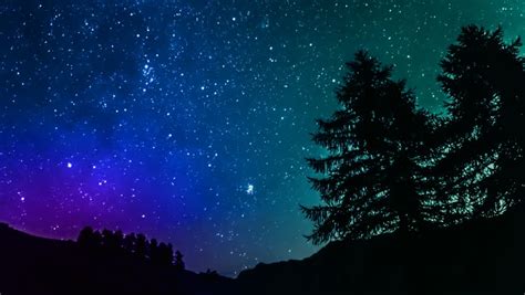 Timelapse Of Stars Moving In Night Sky Over Mountain Stock