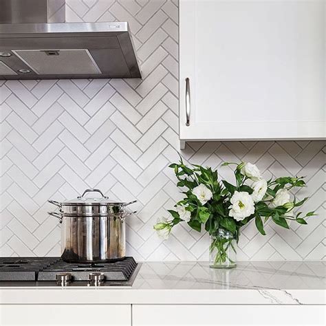 I started this wall by marking a level line about 1/8 inch from the top of the countertop. cloe creme 2.5x8 tile backsplash herringbone - Google ...