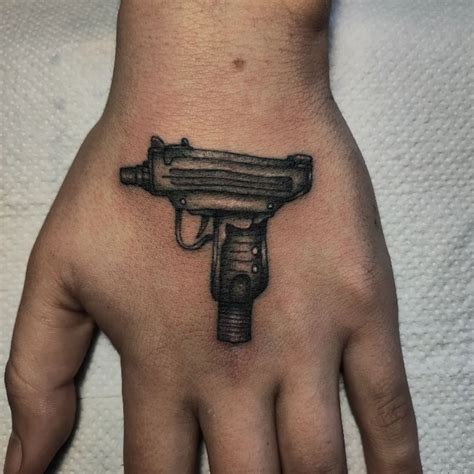 Gangster Gun Tattoo On Hand By Samttsm Tattoogrid Net