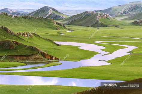 Beautiful Landscape With Mountains And Bayinbuluke Grassland In