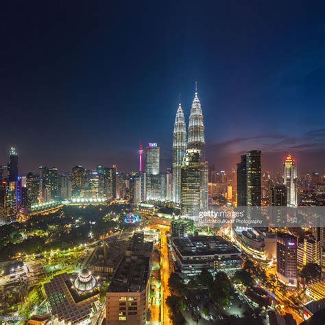 The golden triangle is the business centre of kuala lumpur. View of Kuala Lumpur skyline during blue hour at the ...