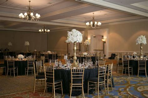 Elegant Ballroom Wedding Reception With Tall White Flower Centerpieces
