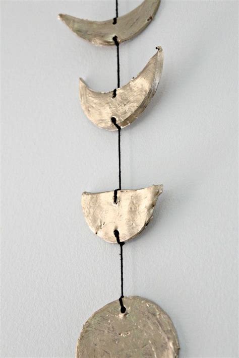 The pictures show the hangings in different light settings which may cause shine or matte effect. Moon Phase Wall Decor, Gold Moon Phase, Clay Moon Wall Hanging, Astrology Decor, Moon Decor ...
