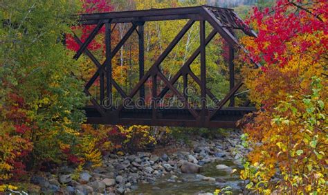 Train Trestle Crossing A New England Stream In The Autumn With Bright