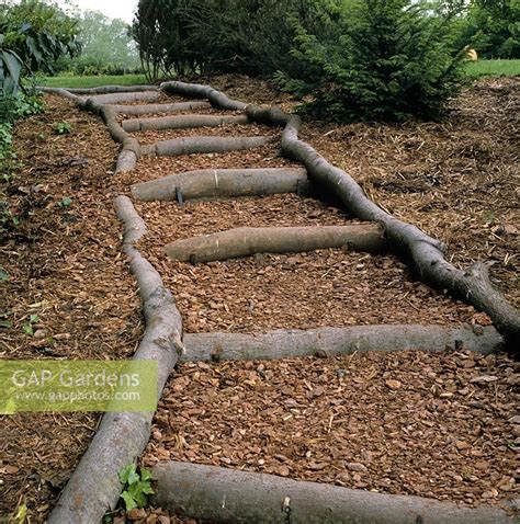 Dig out any weeds and make sure that the soil is moist and lay weed barrier fabric. GAP Gardens - Garden Steps made from Log risers with bark ...