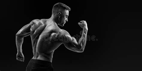 Strong Back Of A Athletic Muscular Man Flexing His Arms Stock Image