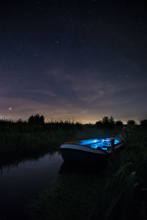 Download Wallpaper 2000x3000 Boat Starry Sky Night Lake Hd Background
