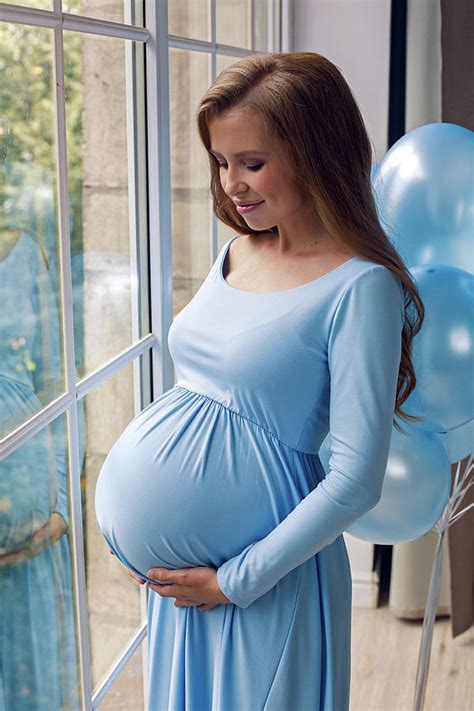 Beautiful Young Pregnant Girl In Blue Long Dress With Blue Balloons