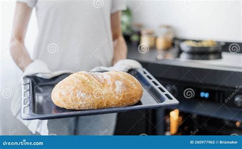 Housewife Cooking And Baking Bread At Kitchen Cropped Shot Stock Image