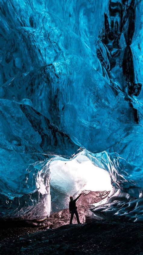 Download 750x1334 Cave Blue Ice Crystals Man Glowing Wallpapers For