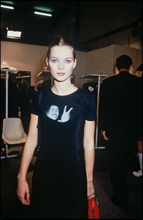 backstage at paris fashion week in 1994 wearing a statement tee kate moss 90s style