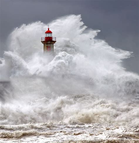 Huge Waves At Lighthouse Near Nazare Portugal See Videos At