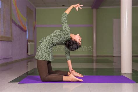 Yogi Woman Presents Yoga Exercises In A Studio Stock Photo Image Of Meditating Yogi