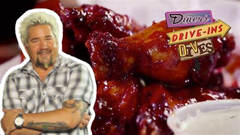 guy fieri tries award winning smoked chicken wings diners drive ins and dives food network