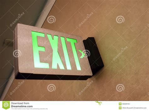 Wall Mounted Exit Sign Shows People Way Out Public
