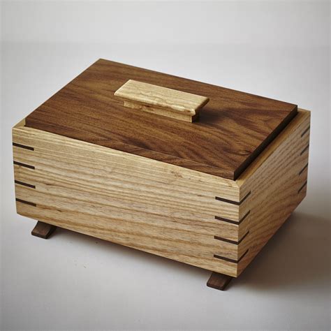 grain wrapped ash and walnut keepsake box with splined miter joints inset lid and arched feet