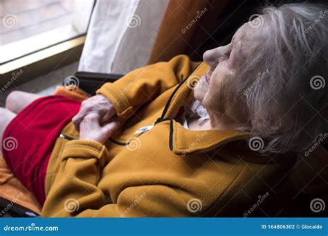 Old Woman Looking In A Window Stock Photo Image Of Mature