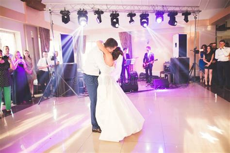 First Wedding Dance Of Newlywed Couple In Restaurant Editorial Stock