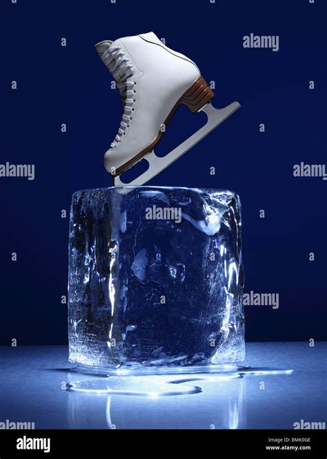 A Frozen Block Of Ice With A White Ice Skate On A Metal Surface Stock