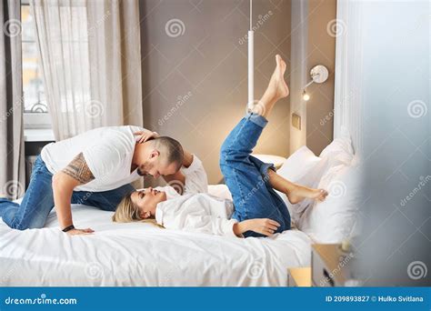 Woman Looking Up At Her Husband Leaning Over Her Stock Image Image Of