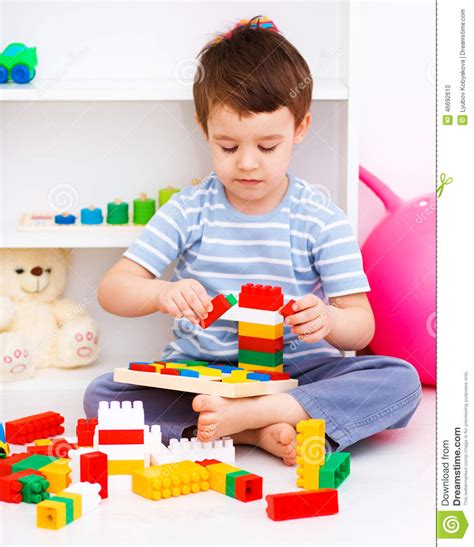 Boy Is Playing With Building Blocks Stock Photo Image Of Male