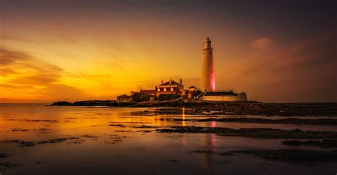 White Lighthouse Near Seashore · Free Stock Photo