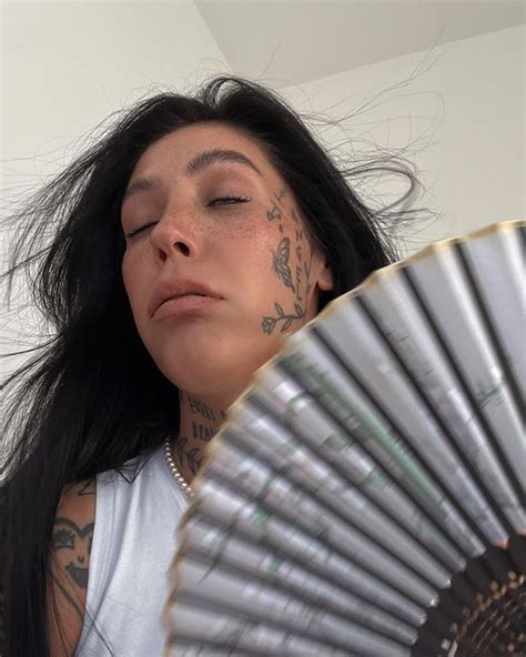 Tattoo Model Strips To Flaunt Inkings As She Works Up A Sweat In The Heat